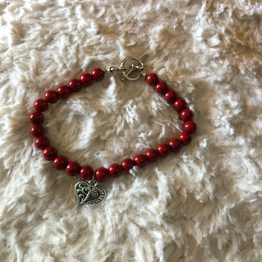 Red bracelet with heart